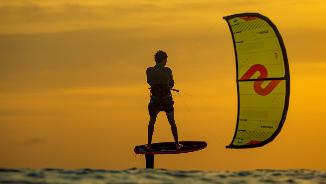 Kimo Riding a Slingshot Ghost and Dwarfcraft Foil Board